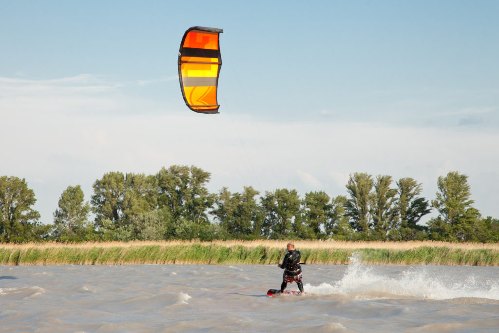 A kiter kites in wind